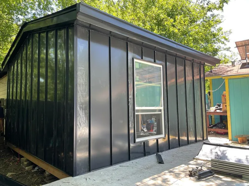 Black standing seam metal wall panels for Roof Inspection in Creve Coeur